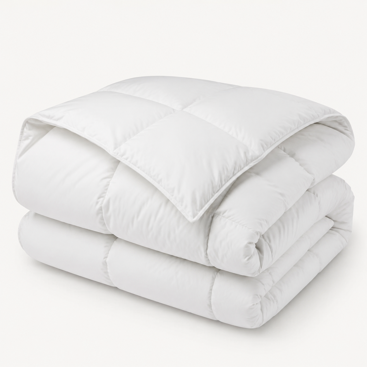 White microfibre hollowfibre duvet, folded on a white studio background
